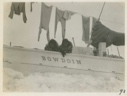 Image of Bow of Bowdoin - Eskimo children leaning over rail
